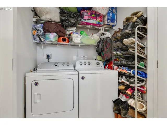 a utility room with dryer washer and other items