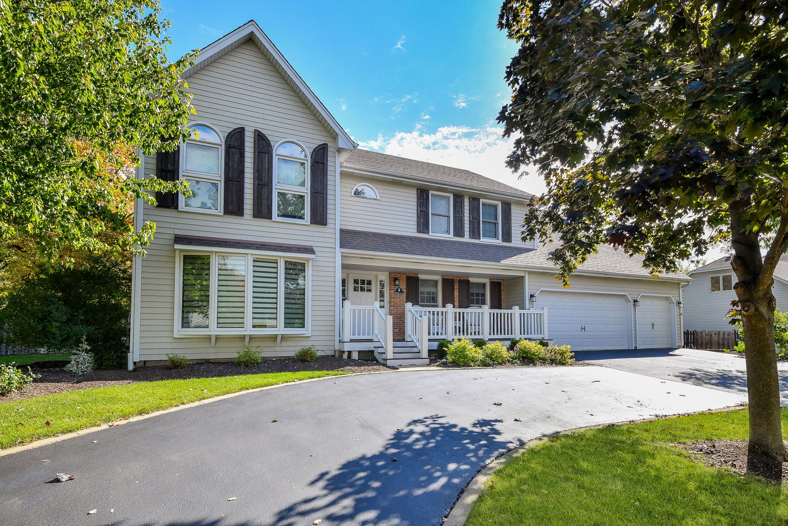 1206 Beckman Lane Batavia, IL 60510 - Photo 1 of 42 a front view of a house with a yard and potted plants
