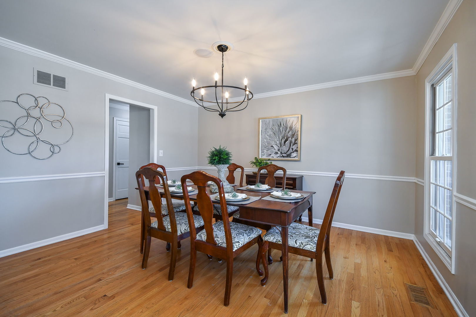 1206 Beckman Lane Batavia, IL 60510 - Photo 12 of 42 a view of a dining room with furniture window and wooden floor