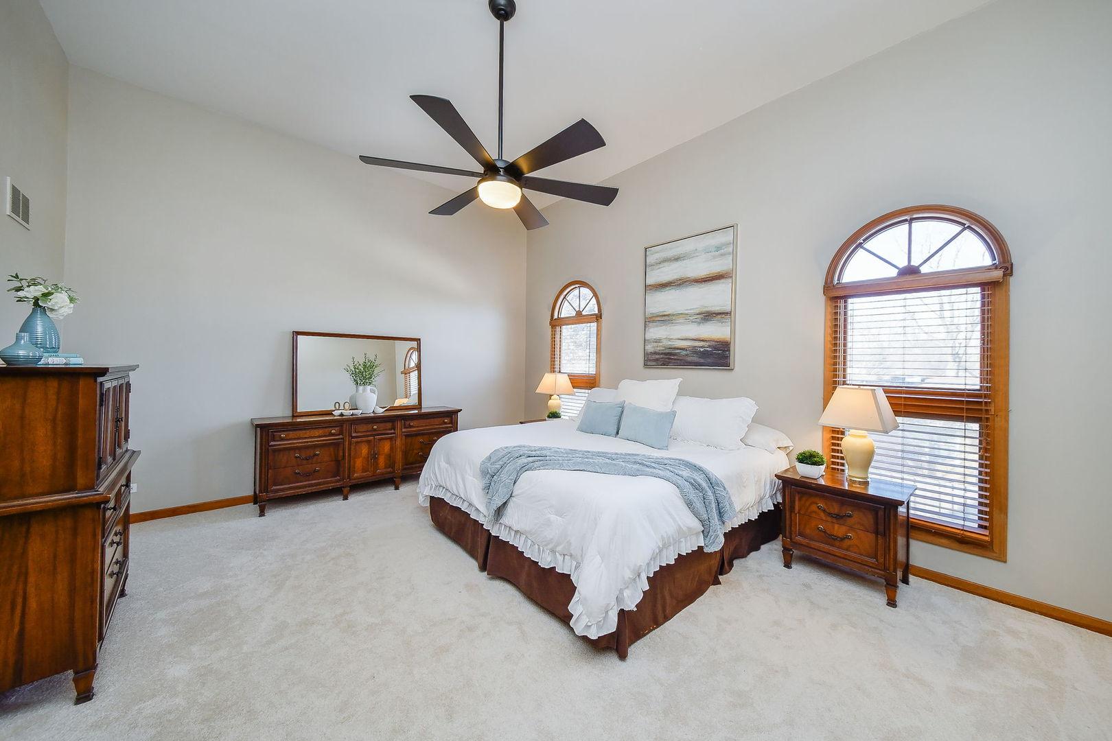 1206 Beckman Lane Batavia, IL 60510 - Photo 17 of 42 a spacious bedroom with a bed and a chandelier