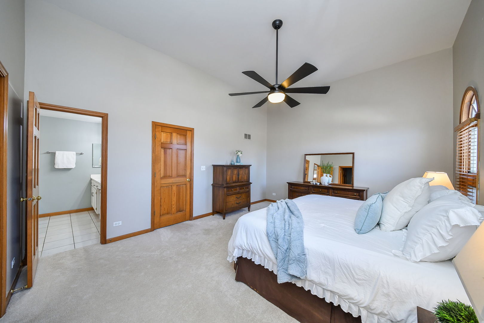 1206 Beckman Lane Batavia, IL 60510 - Photo 18 of 42 a bedroom with a large bed and a tv