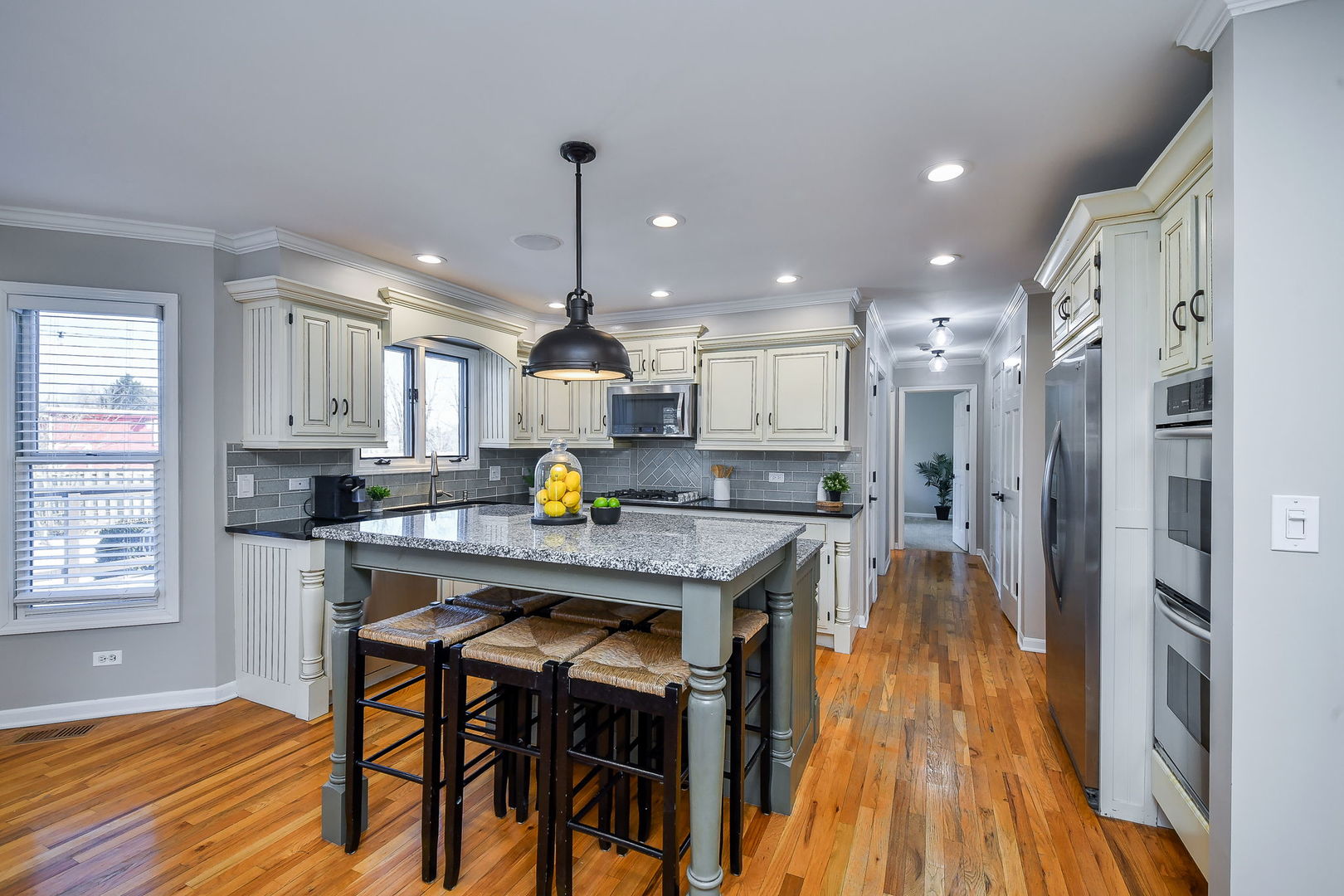 1206 Beckman Lane Batavia, IL 60510 - Photo 2 of 42 a kitchen with stainless steel appliances granite countertop a refrigerator a sink dishwasher a stove and white cabinets with wooden floor