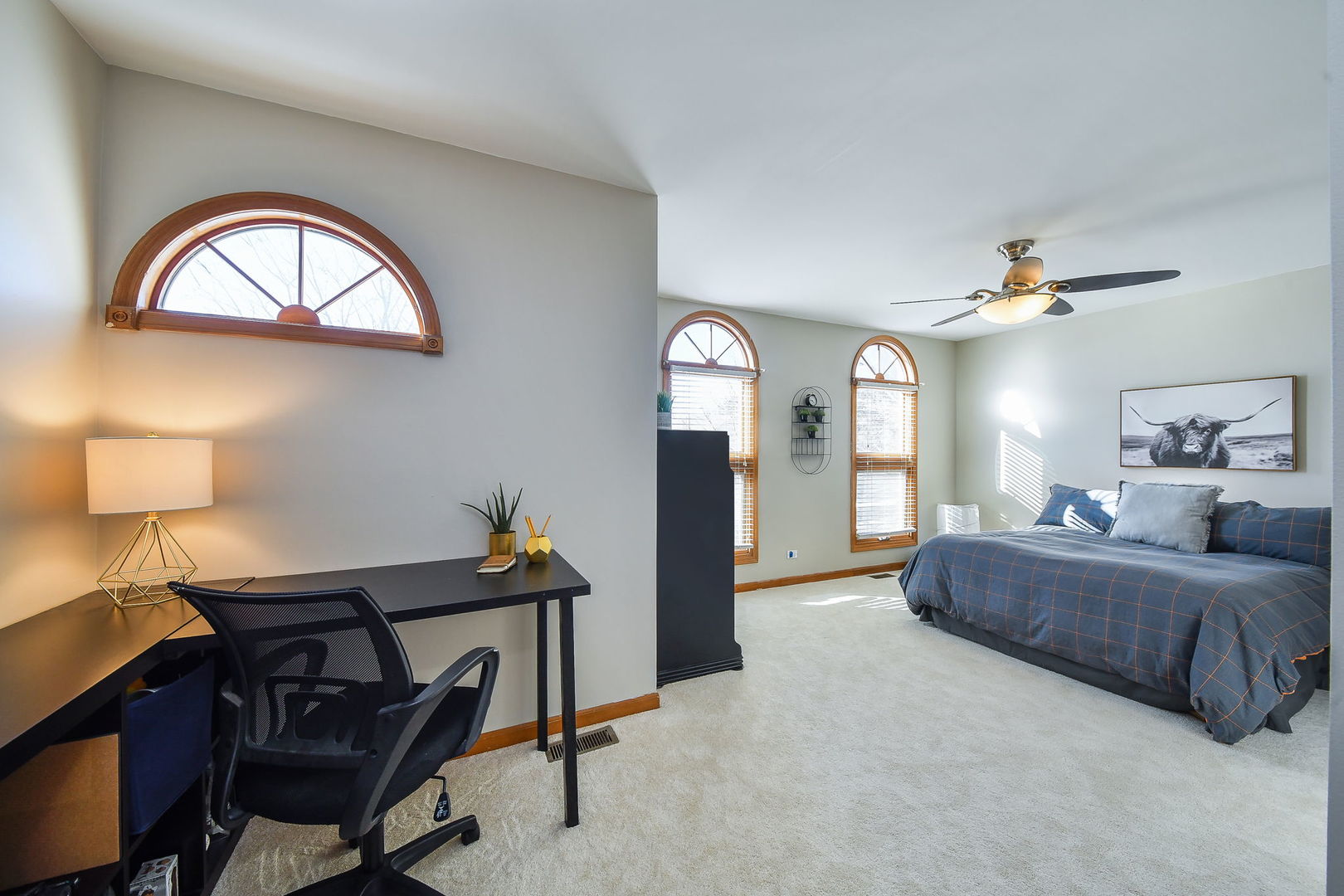 1206 Beckman Lane Batavia, IL 60510 - Photo 22 of 42 a bedroom with a bed and a chandelier