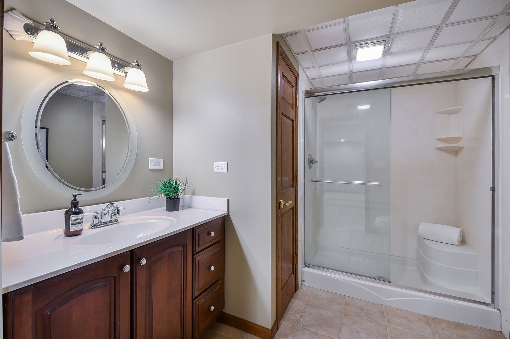 1206 Beckman Lane Batavia, IL 60510 - Photo 31 of 42 a bathroom with a double vanity sink mirror and shower