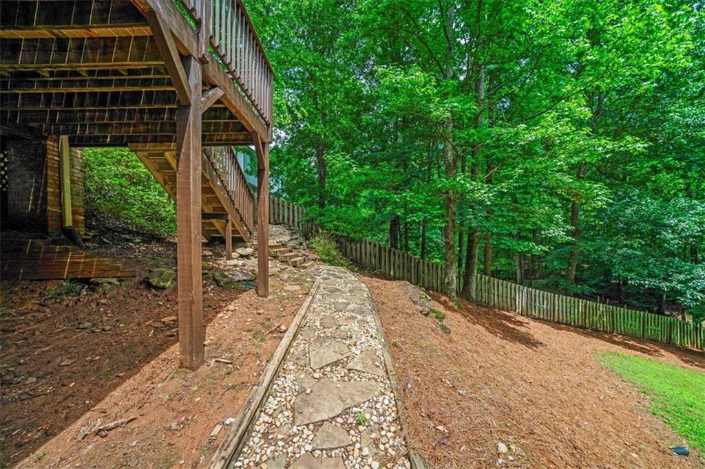 1710 Rising Mist Lane Cumming, GA 30041 - Photo 106 of 111 a view of a backyard with sitting area