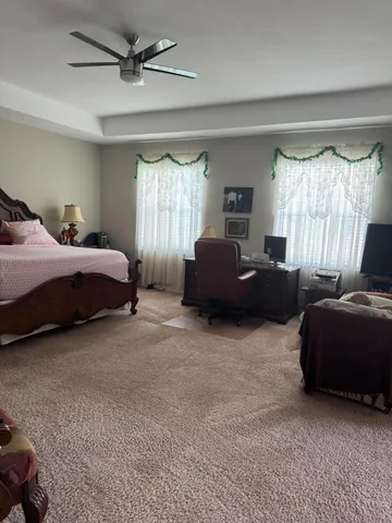 a living room with a bed furniture and a window
