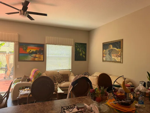 a living room with furniture a couch and a window