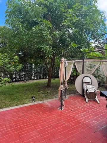 a house view with a garden space