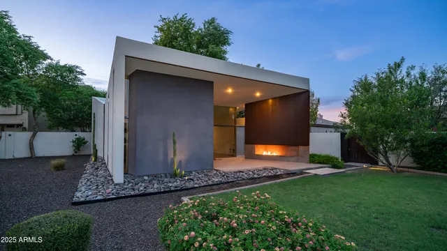 a view of an empty room with a fireplace and a window
