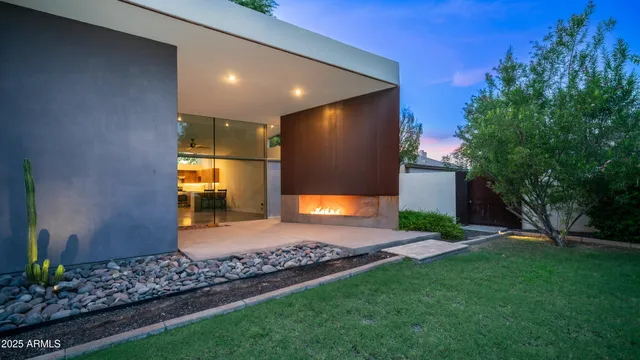 a view of a hallway with wooden floor and entryway