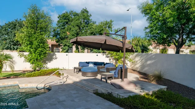 a large kitchen with stainless steel appliances granite countertop a lot of counter space and wooden floors