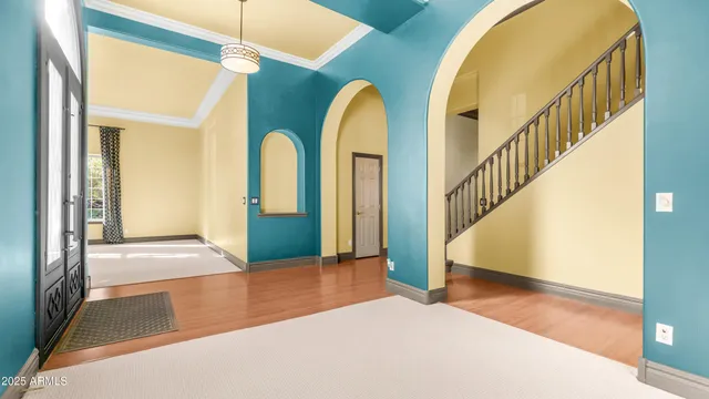 a view of an empty room with closet and a window