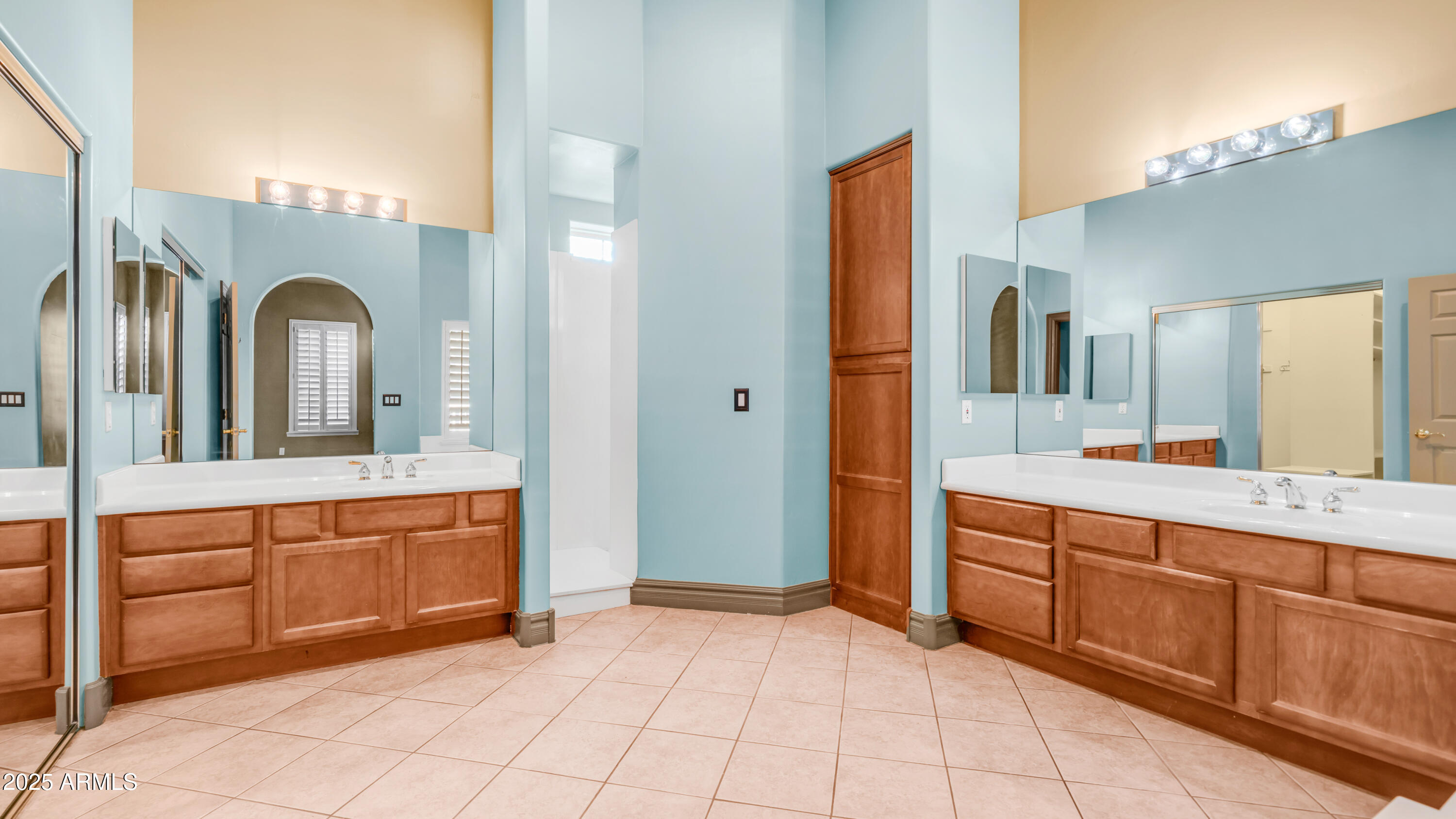 7467 South Rita Lane Tempe, AZ 85283 - Photo 43 of 111 a spacious bathroom with a granite countertop sink a mirror and a bathtub