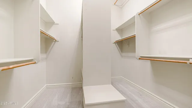 an aerial view of a house with a yard and garden