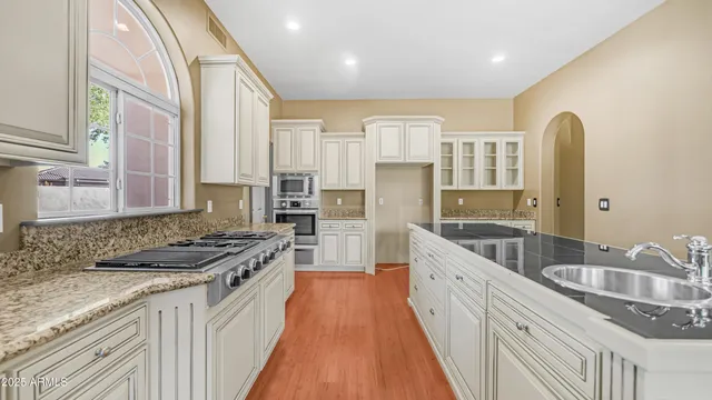 a view of empty room with a fireplace