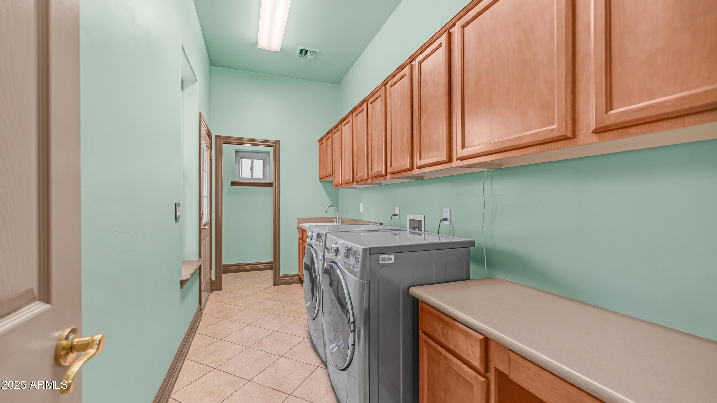 7467 South Rita Lane Tempe, AZ 85283 - Photo 67 of 111 a utility room with a sink washer and dryer