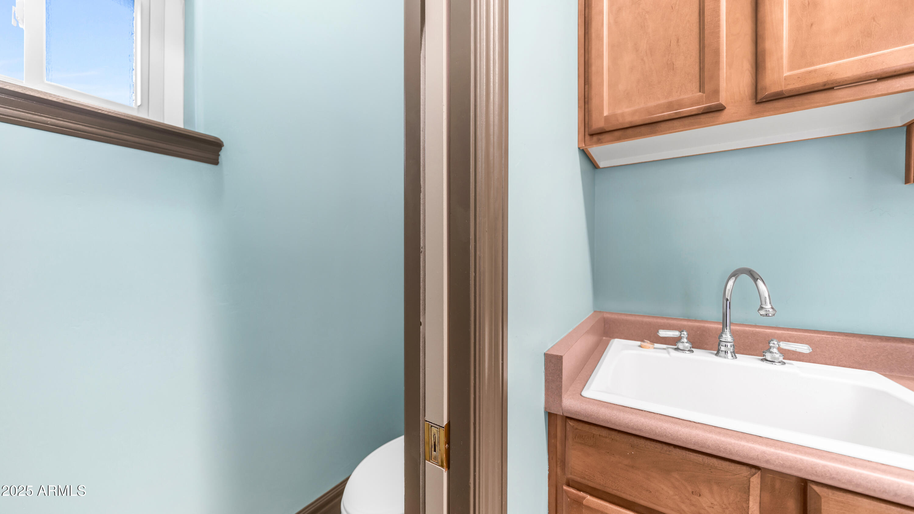 7467 South Rita Lane Tempe, AZ 85283 - Photo 68 of 111 a bathroom with a sink and a mirror