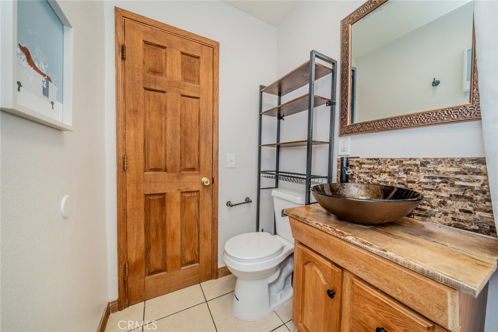 1724 Thrush Road Wrightwood, CA 92397 - Photo 13 of 39 a bathroom with a toilet a sink and shower