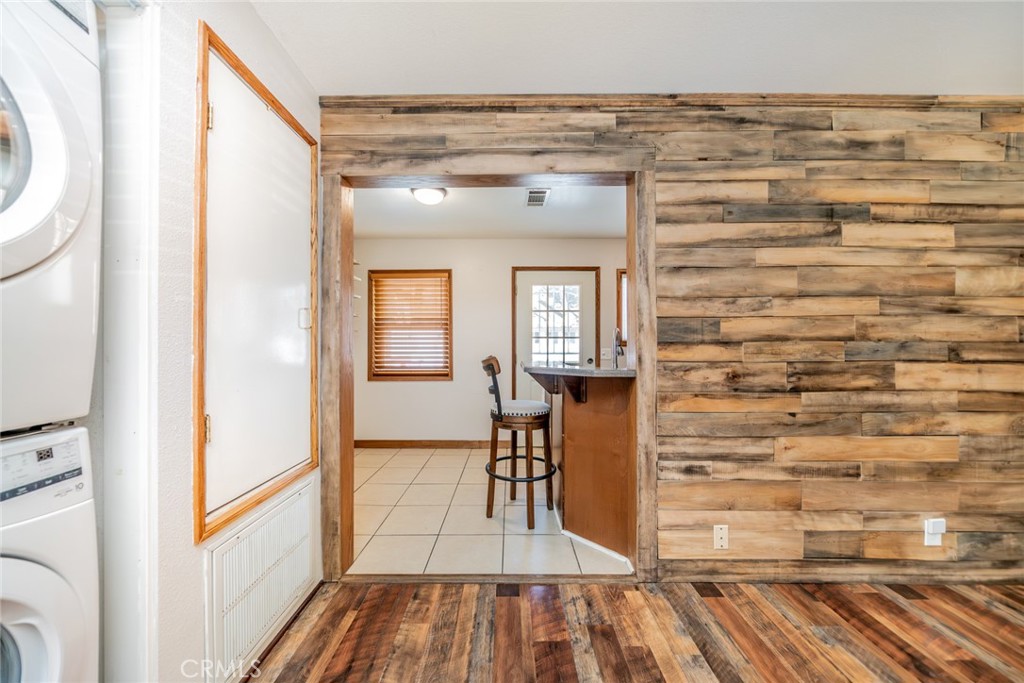 1724 Thrush Road Wrightwood, CA 92397 - Photo 17 of 39 a view of a hallway with wooden floor and staircase