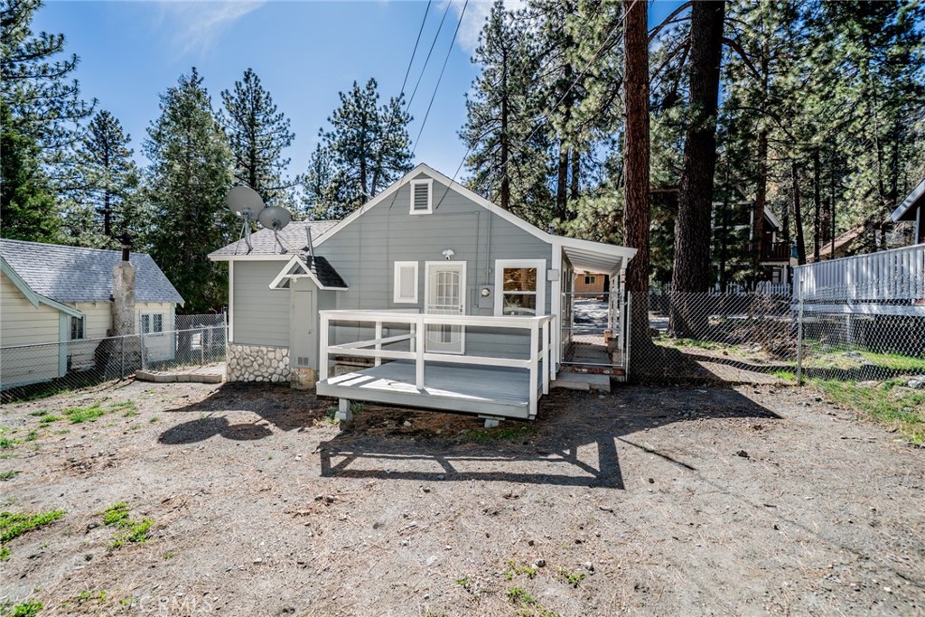 1724 Thrush Road Wrightwood, CA 92397 - Photo 19 of 39 a front view of a house with a yard covered in snow