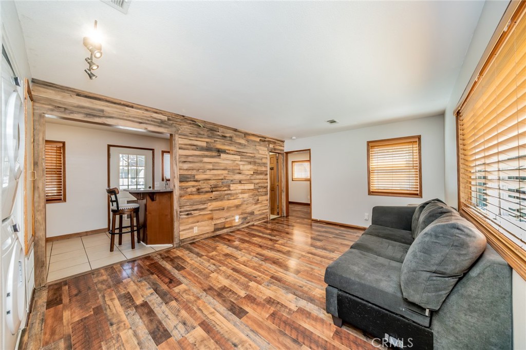 1724 Thrush Road Wrightwood, CA 92397 - Photo 5 of 39 a living room with furniture and a flat screen tv