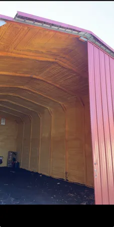 a view of an empty room and wooden floor