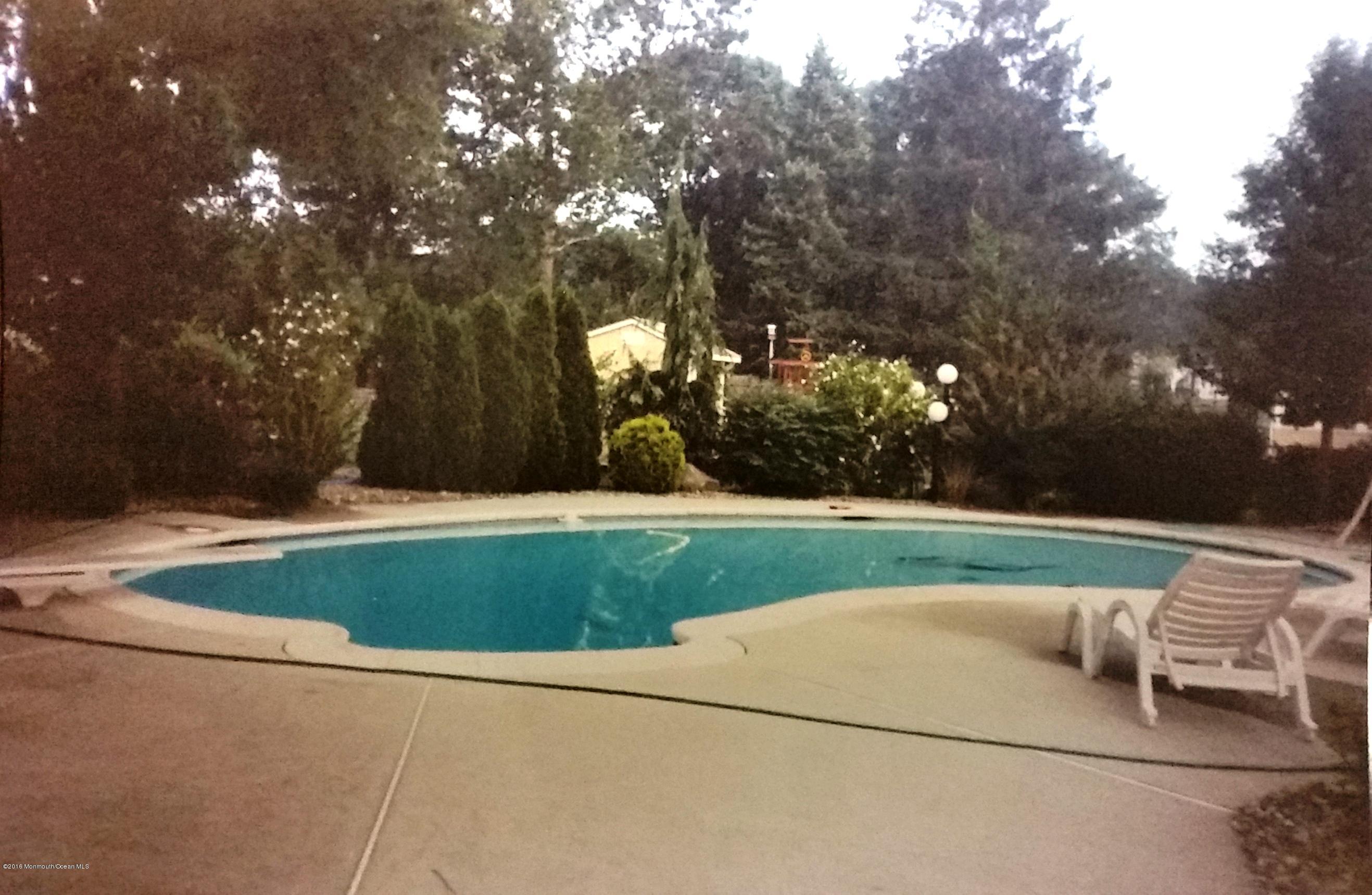 75 Nottingham Drive Brick, NJ 08724 - Photo 30 of 33 pool in summer