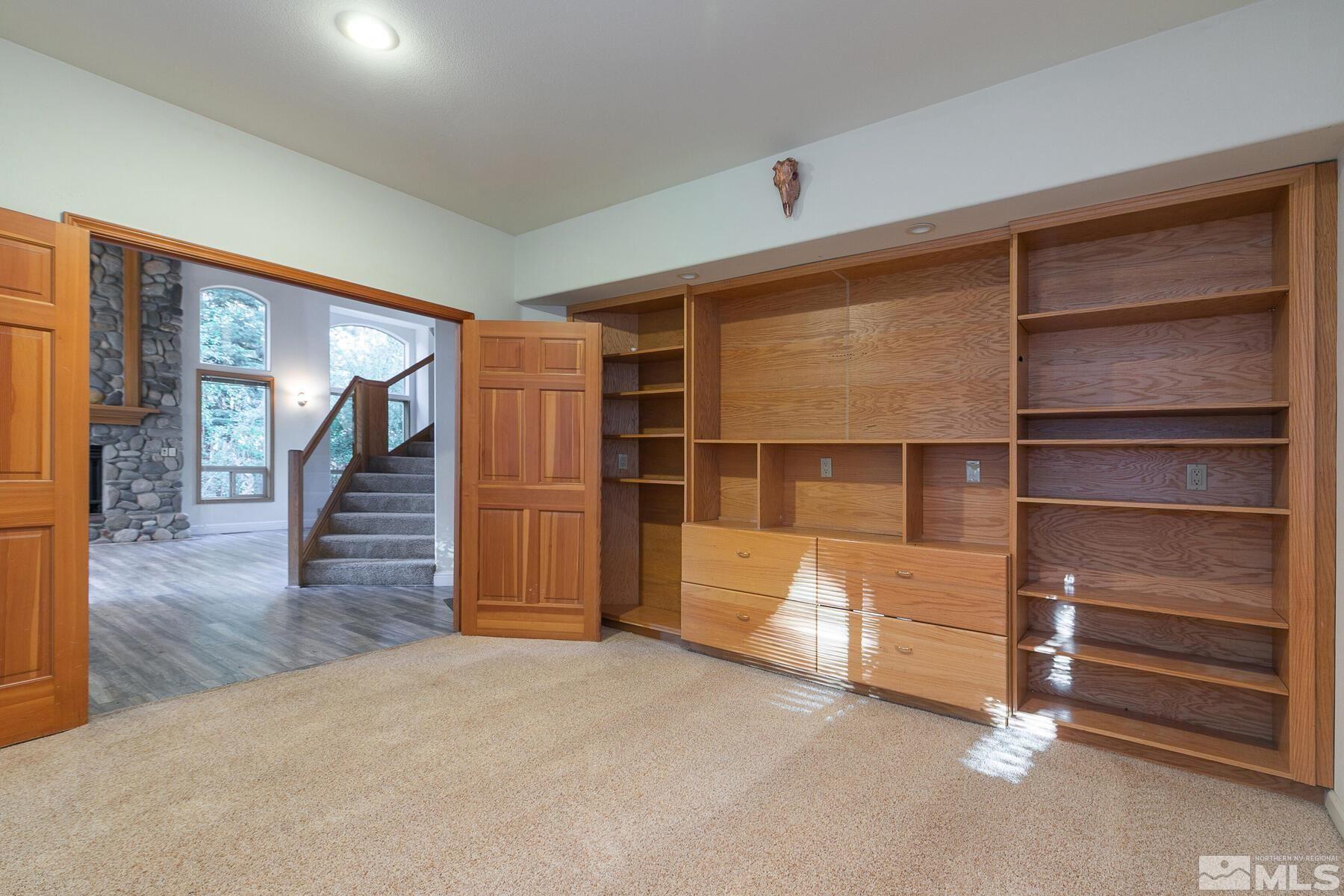 119 Meadow Drive Stateline, NV 89449 - Photo 11 of 30 a view of an empty room with wooden floor and a window