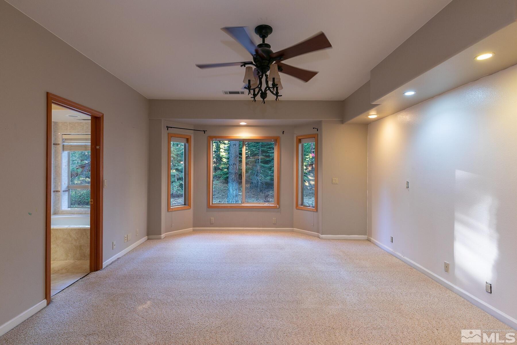 119 Meadow Drive Stateline, NV 89449 - Photo 18 of 30 a view of a livingroom with a ceiling fan and window