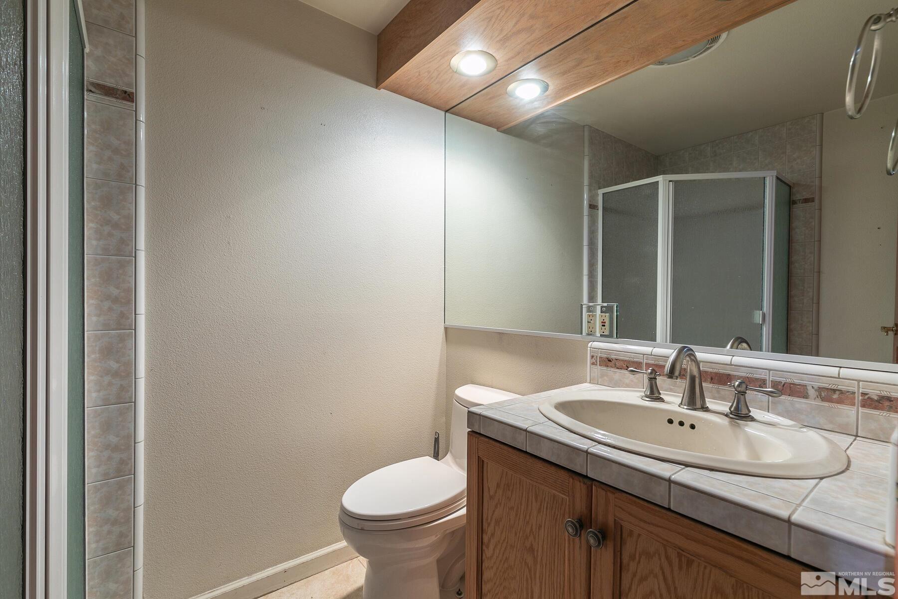 119 Meadow Drive Stateline, NV 89449 - Photo 22 of 30 a bathroom with a sink and a toilet