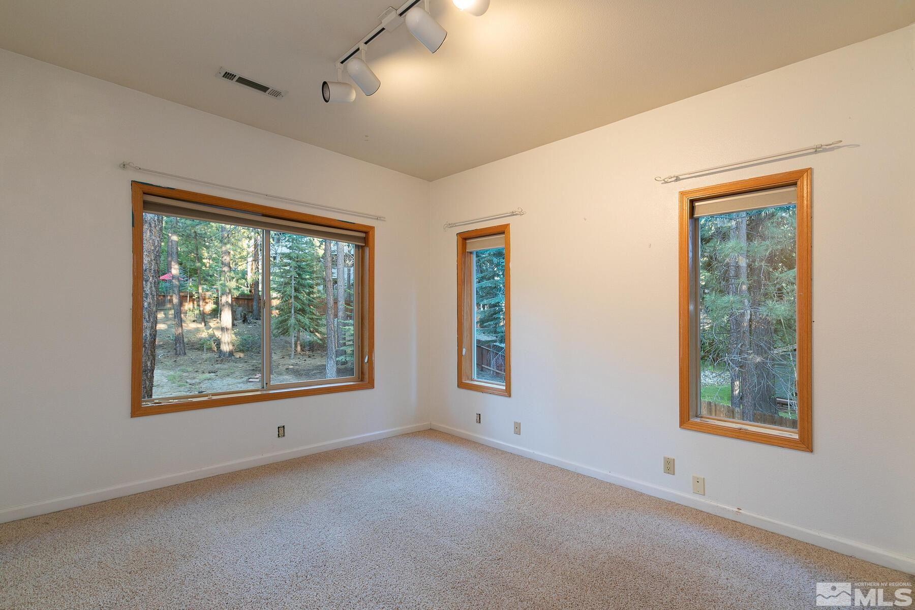 119 Meadow Drive Stateline, NV 89449 - Photo 23 of 30 a view of an empty room with windows