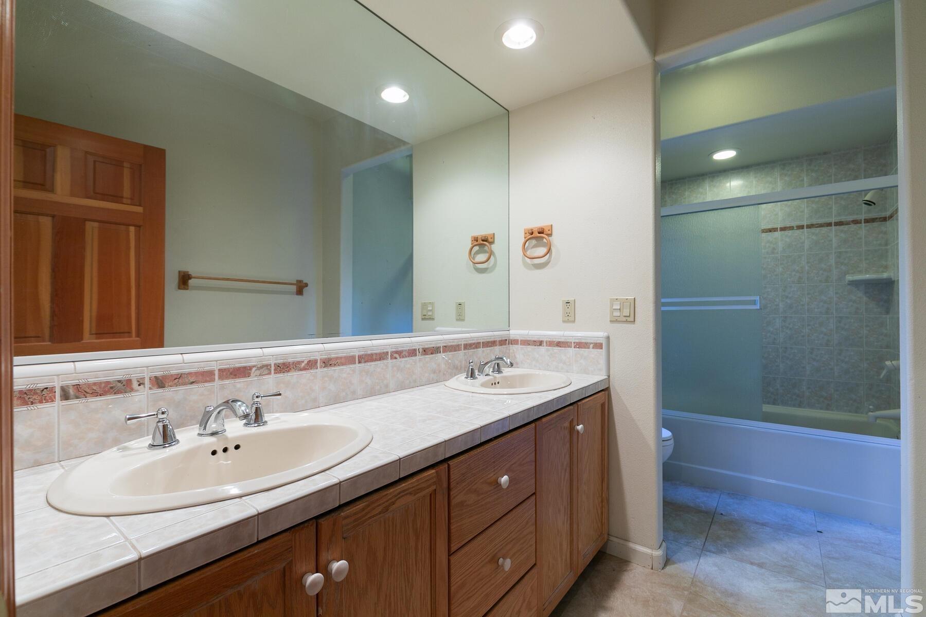 119 Meadow Drive Stateline, NV 89449 - Photo 24 of 30 a bathroom with a sink and a mirror