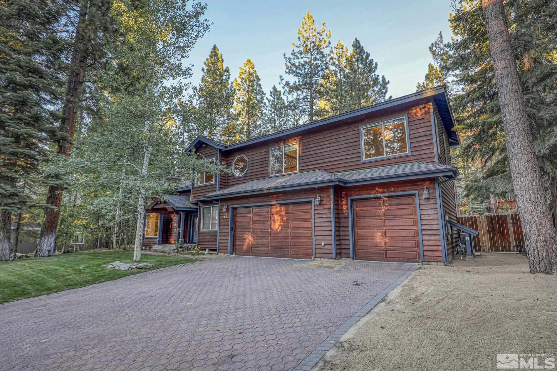 119 Meadow Drive Stateline, NV 89449 - Photo 3 of 30 a front view of a house with a yard and garage
