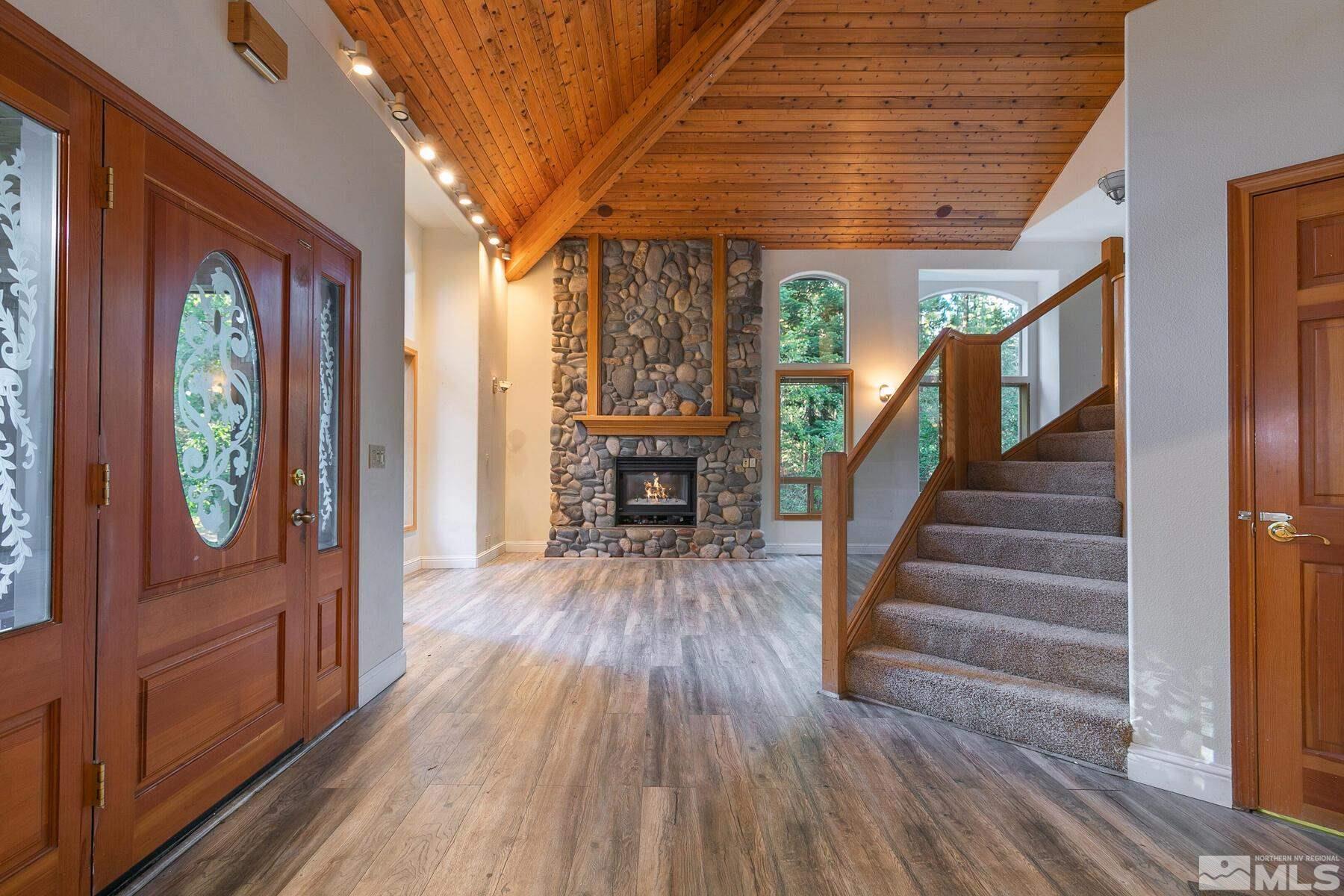 119 Meadow Drive Stateline, NV 89449 - Photo 8 of 30 a view of entryway with wooden floor and stairs