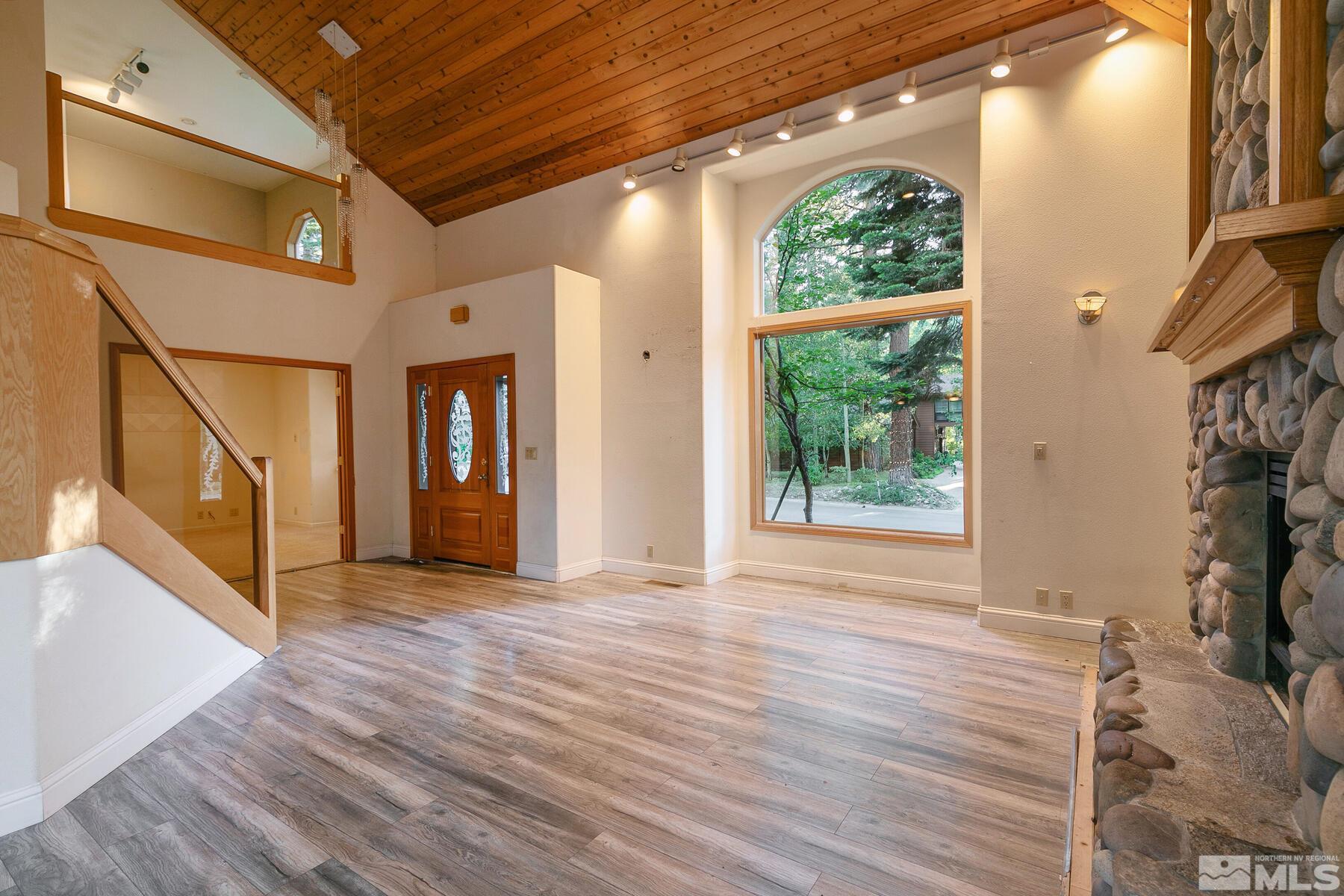 119 Meadow Drive Stateline, NV 89449 - Photo 10 of 30 a view of a hallway with wooden floor and a window
