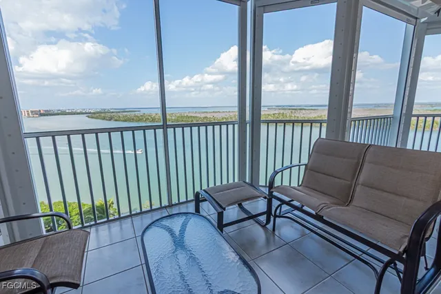 a view of a balcony with chair and table