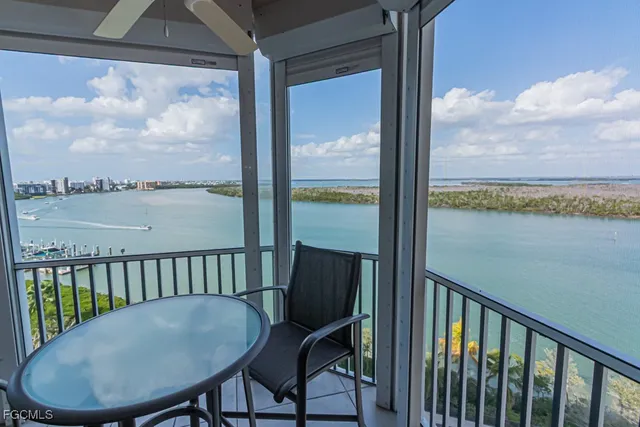 a room with patio outer view and a dining table