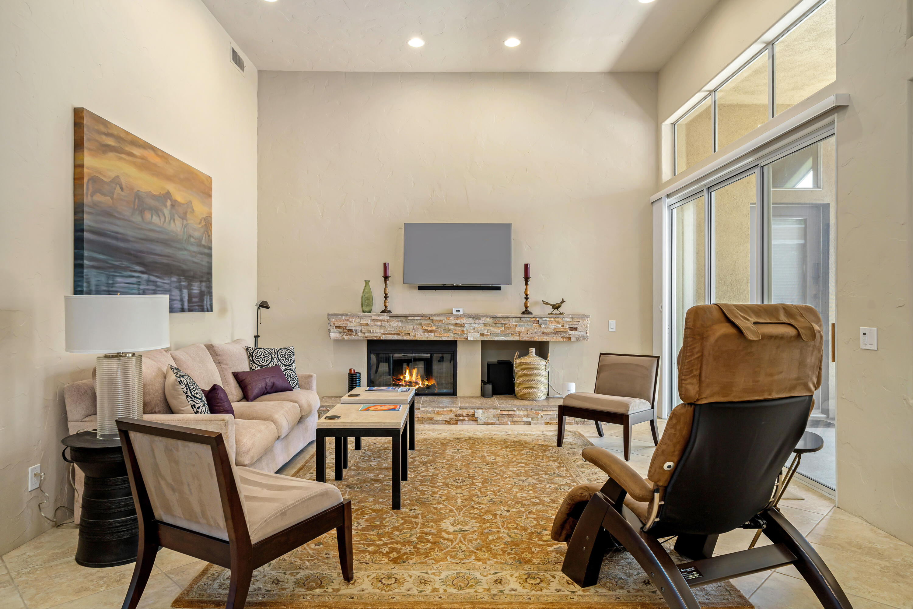56565 Riviera La Quinta, CA 92253 - Photo 13 of 48 a living room with furniture a fireplace and a flat screen tv