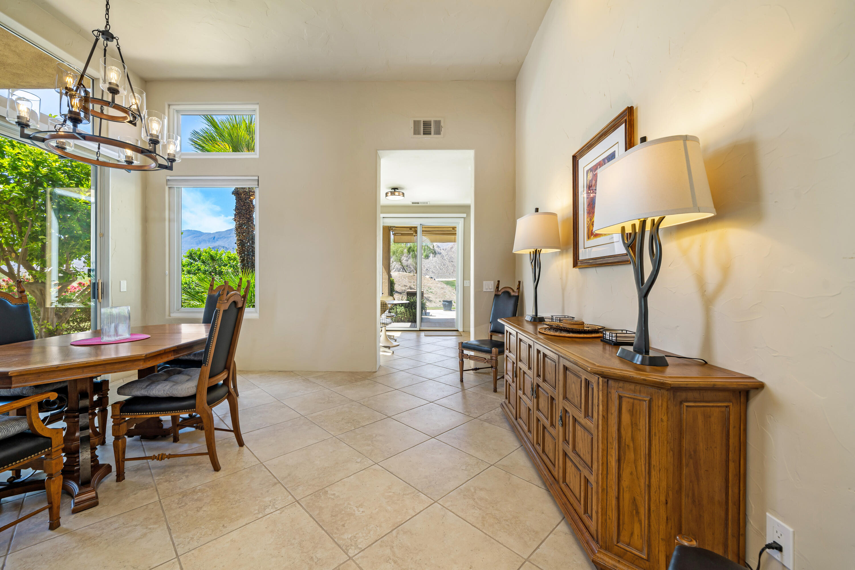 56565 Riviera La Quinta, CA 92253 - Photo 18 of 48 a view of a dining room with furniture window and outside view