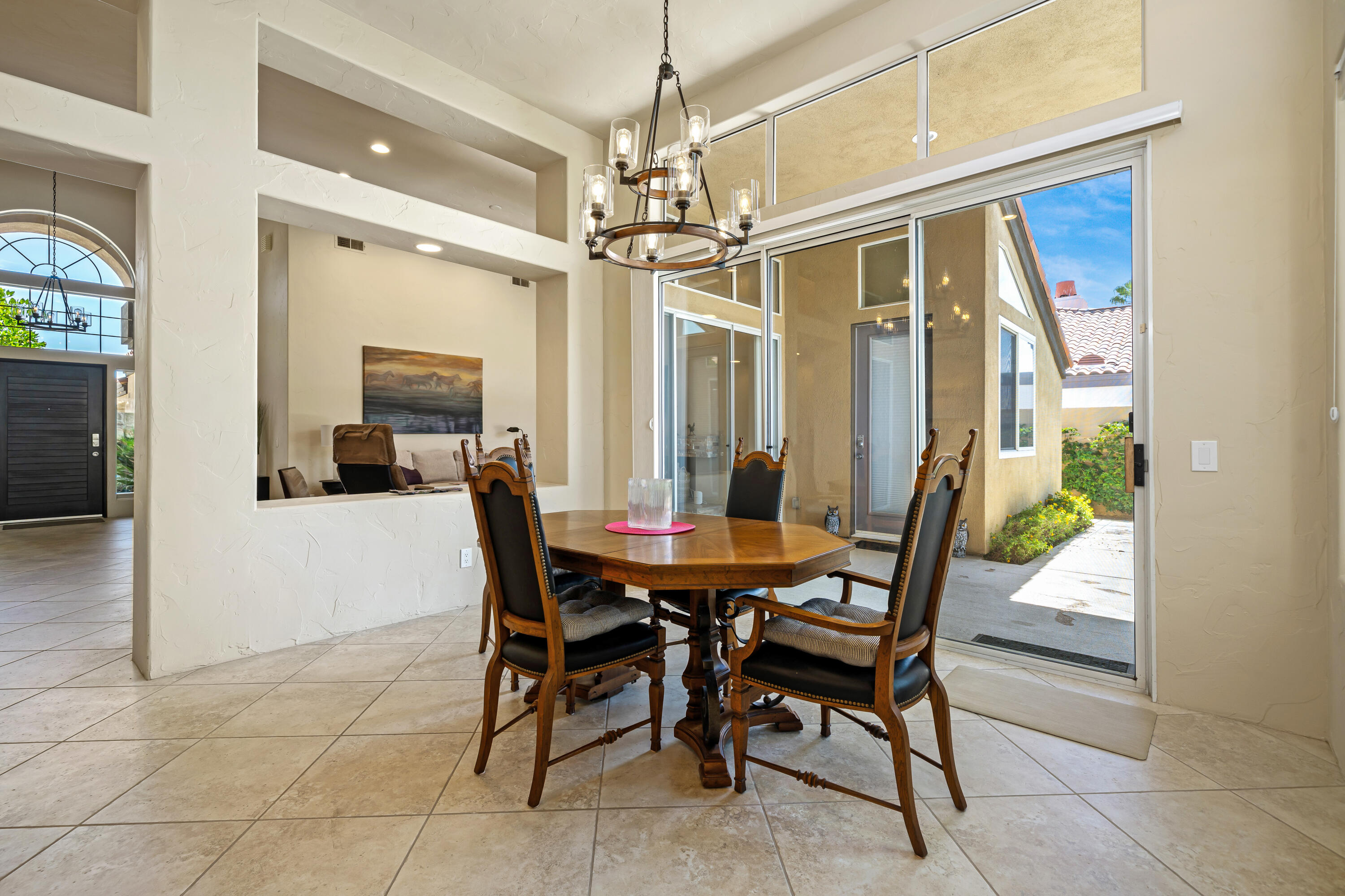 56565 Riviera La Quinta, CA 92253 - Photo 19 of 48 a view of a dining room with furniture window and outside view