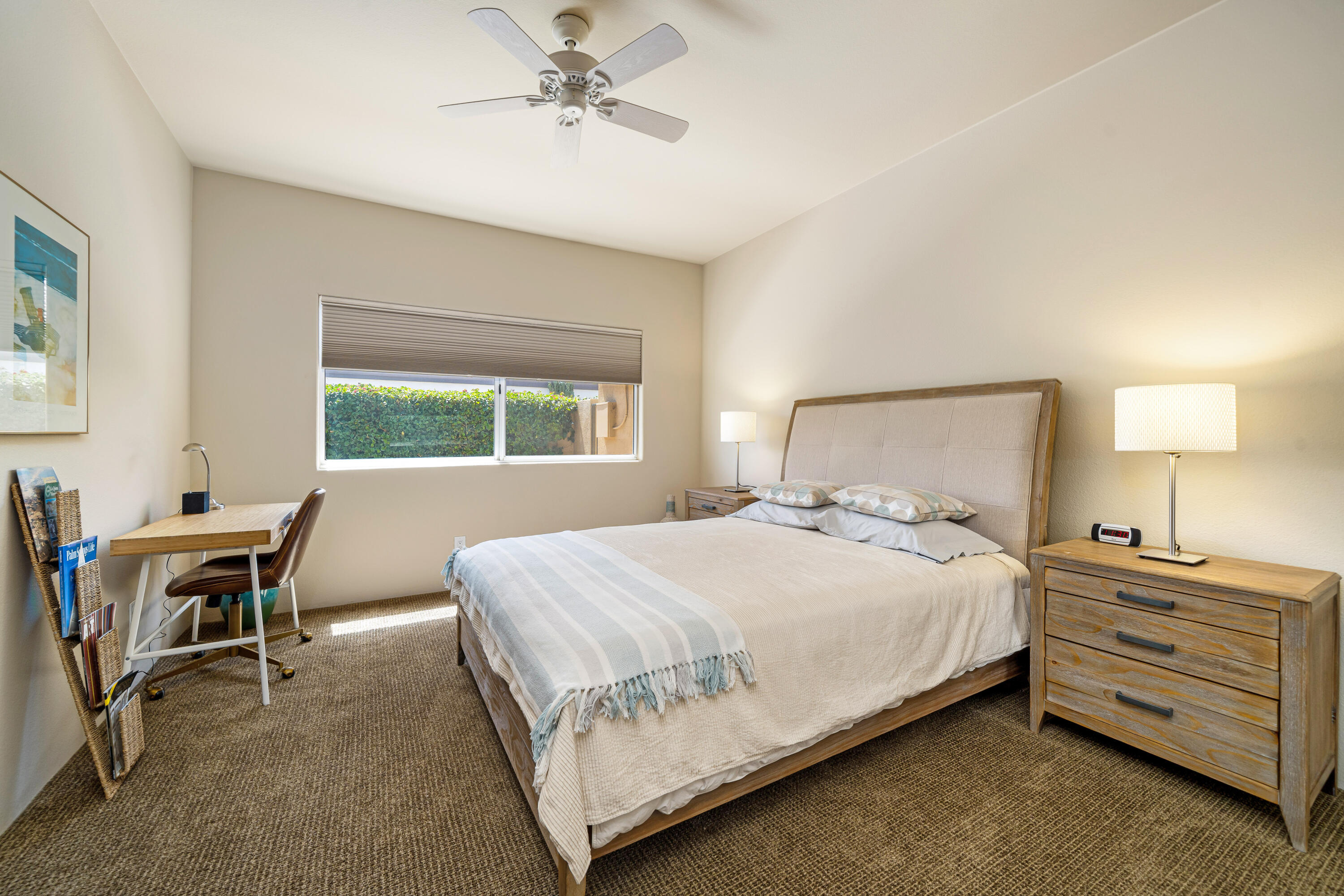 56565 Riviera La Quinta, CA 92253 - Photo 40 of 48 a bedroom with a bed and a table in it