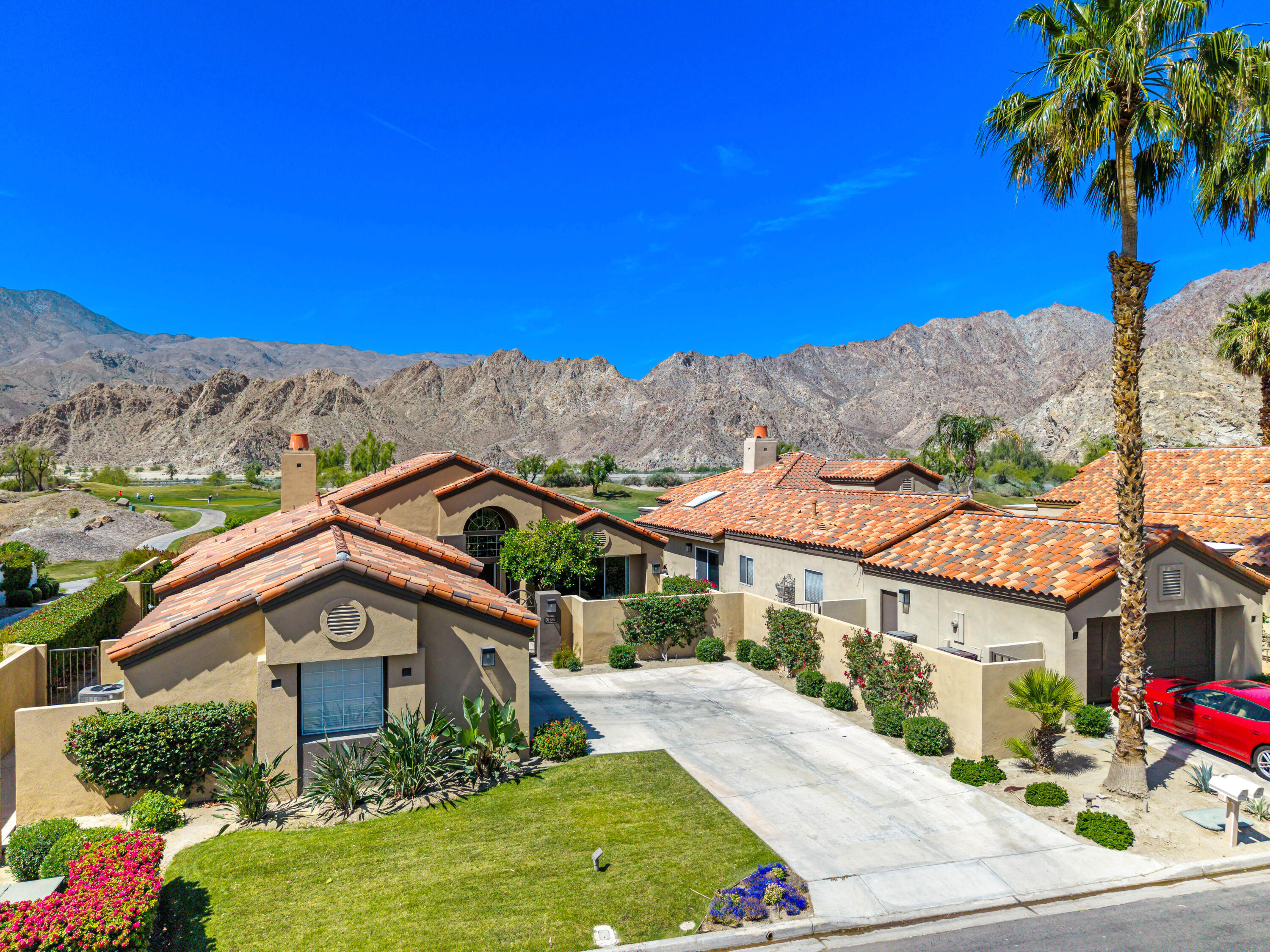 56565 Riviera La Quinta, CA 92253 - Photo 47 of 48 a front view of a house with a yard