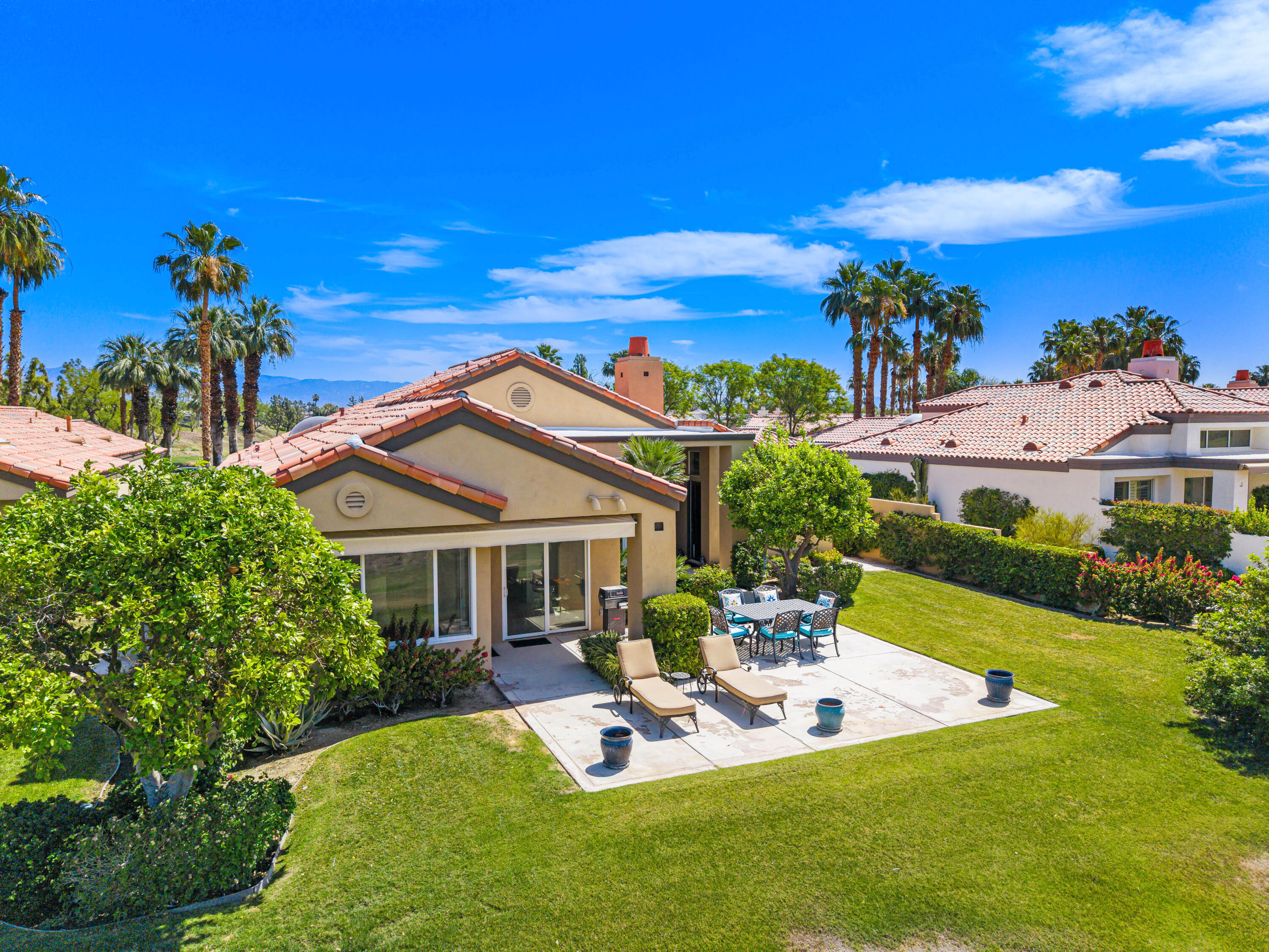 56565 Riviera La Quinta, CA 92253 - Photo 7 of 48 a view of a house with a backyard porch and furniture