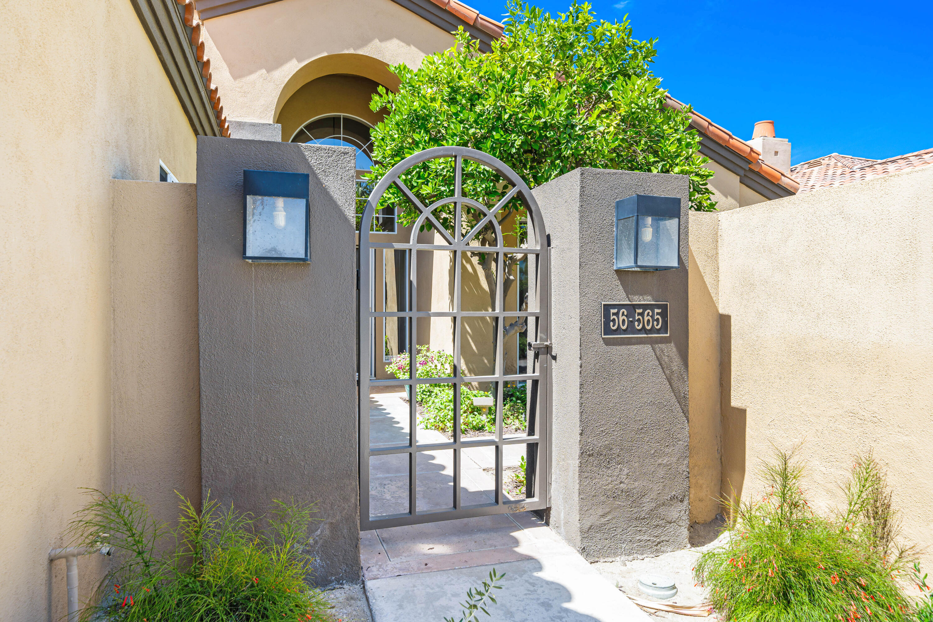 56565 Riviera La Quinta, CA 92253 - Photo 8 of 48 a front view of a house with garden