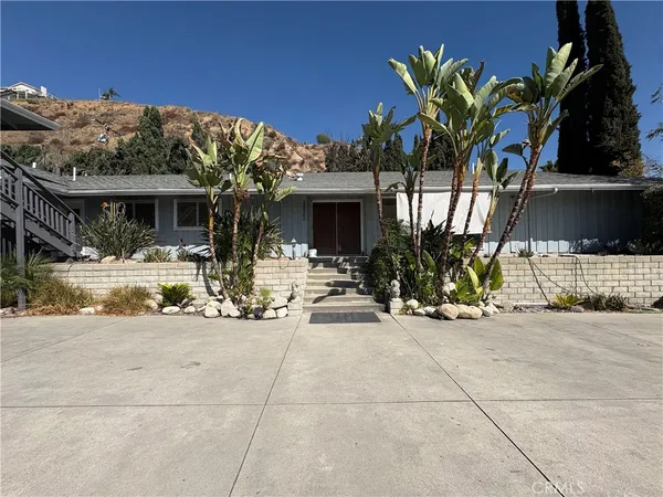 a view of house with outdoor space and porch