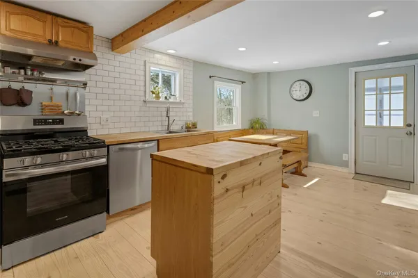 a kitchen with a stove and a sink