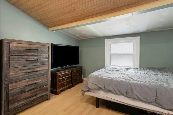 a bedroom with a bed and television