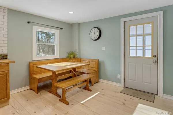 a room with pool table and windows