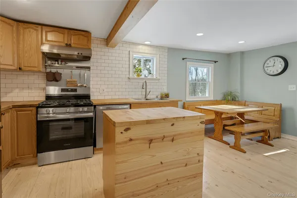 a kitchen with a stove and a sink