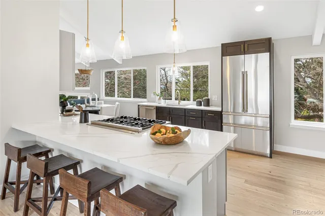 a kitchen with a table and chairs